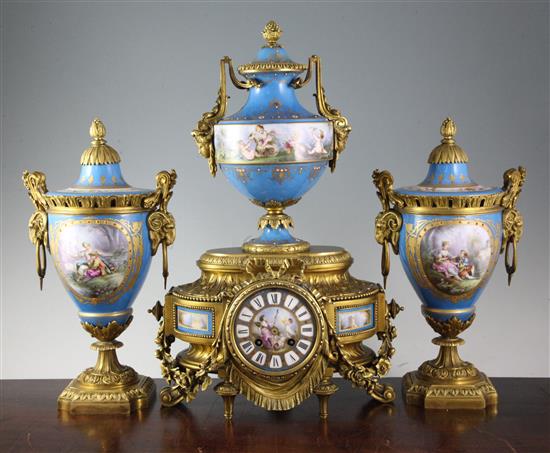 A 19th century French ormolu and jewelled Sevres style porcelain clock garniture, 14in.